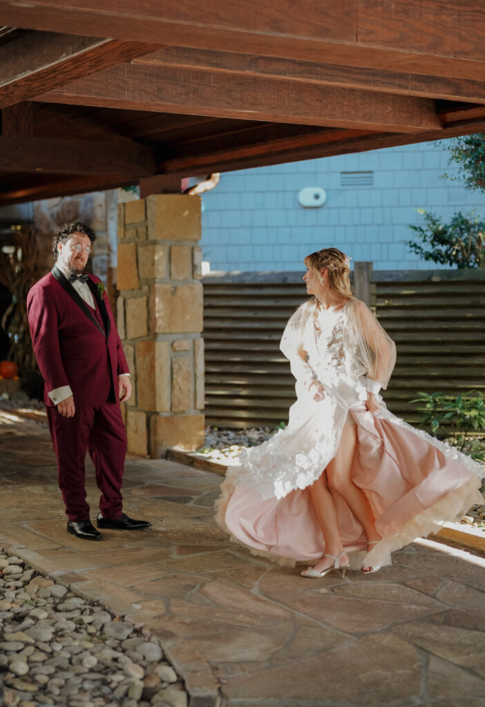 bride twirling after first look with groom