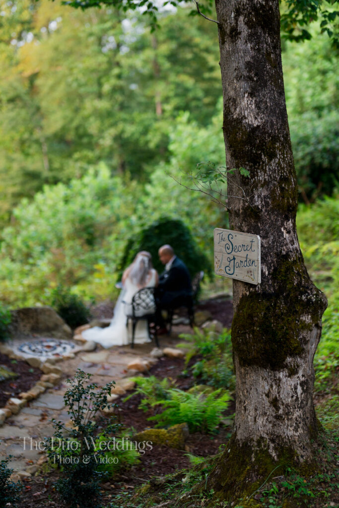 Couple seated in the Secret Garden at Nantahala Wedding Venue North Carolina
