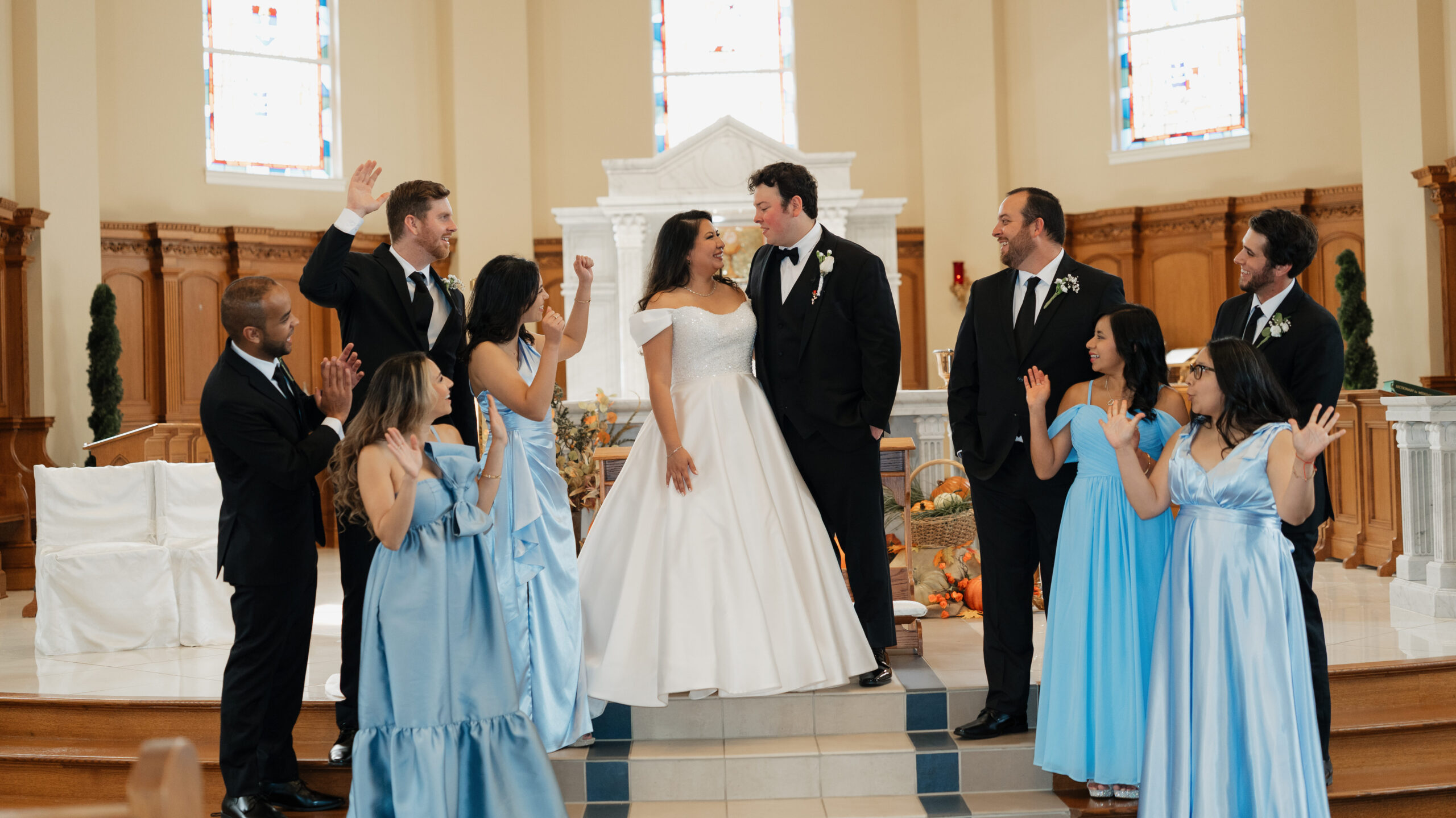 Bride and Groom with wedding party at the alter, in St.Benedict Catholic Church in John's Creek, Georgia