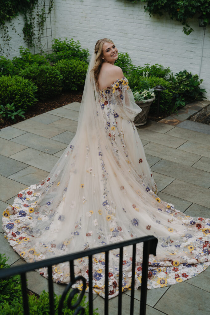 Bride showing off her wedding dress at the Meadowlands at the Darien Community Association. in Darien Connecticut.