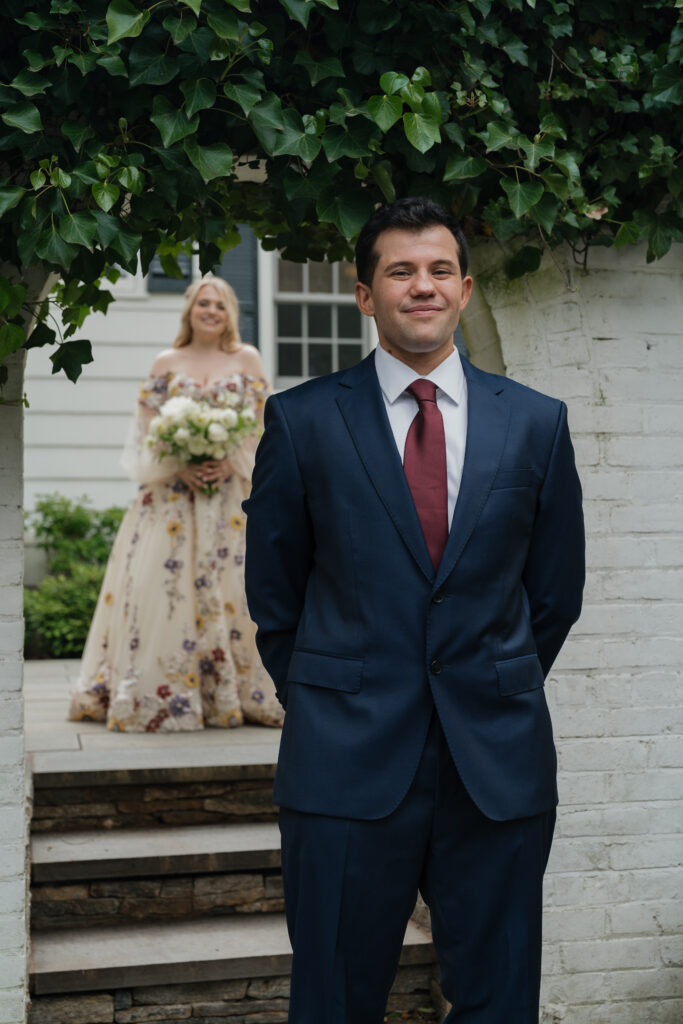 bride and groom doing first look at swan house in atlanta georgia