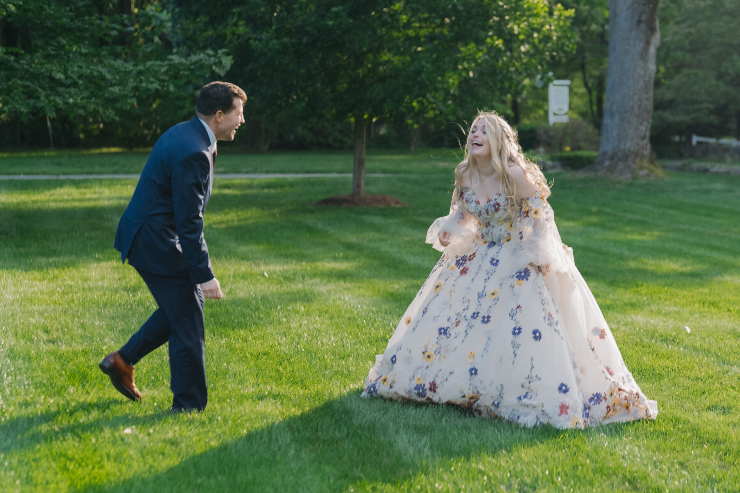 Bride and Groom laughing outside of The Meadowlands at the Darien Community Association.