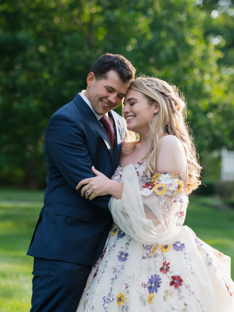 Bride and Groom smiling together at the Meadowlands at the Darien Community Association. in Darien Connecticut.