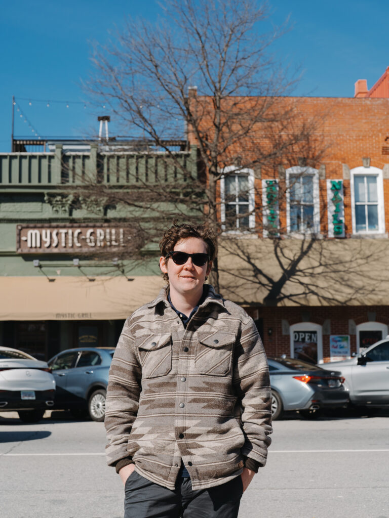 Wedding photographer standing outside Mystic Grill in Covington, GA