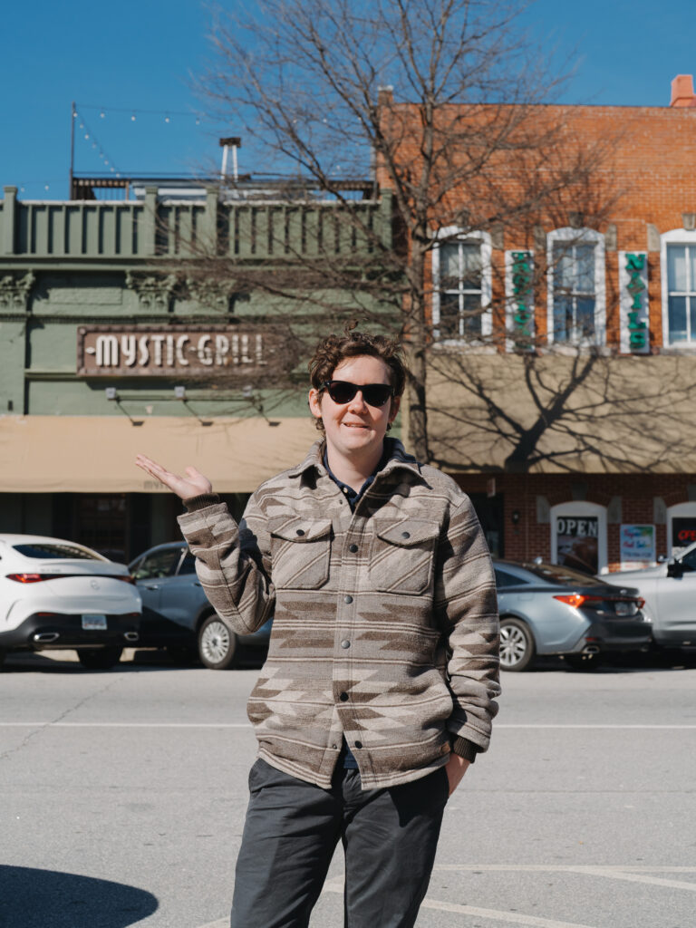 Photographer posing outside the Mystic Grill in Covington, GA