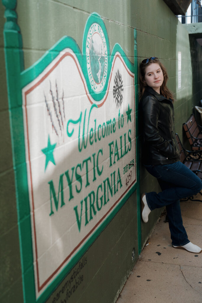 Photographer leaning in the alleyway beside Mystic Grill in Covington, GA