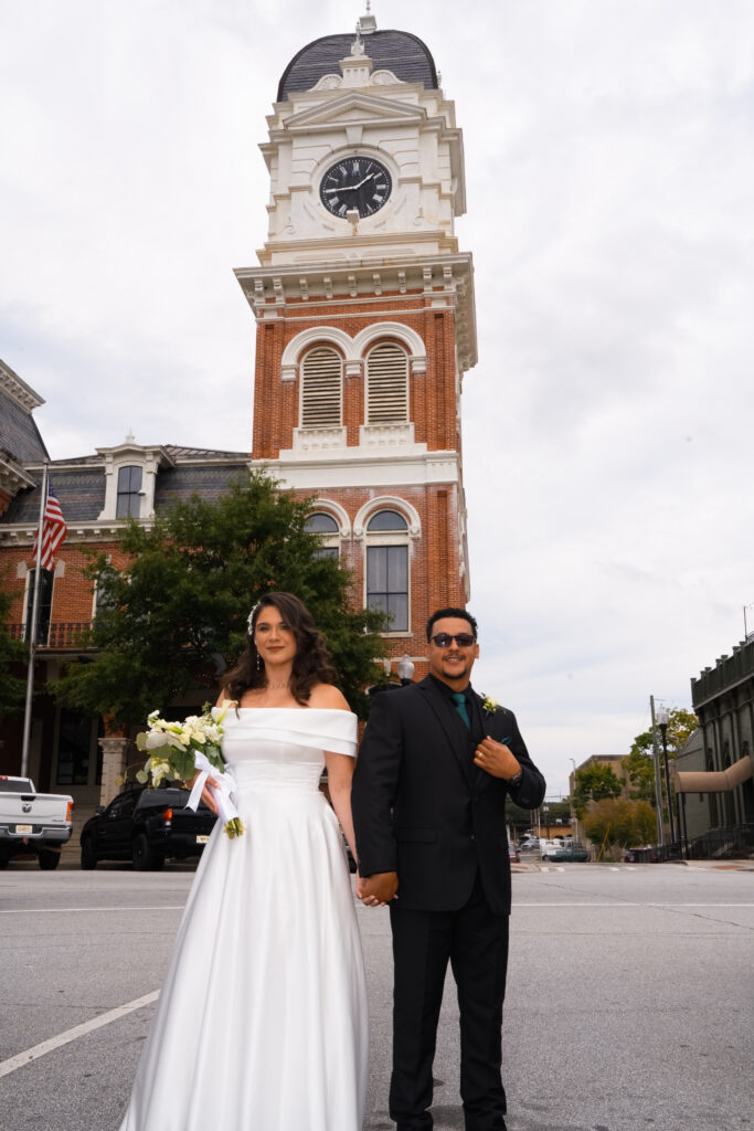 Wedding portraits in front of Clocktower in Covington, GA