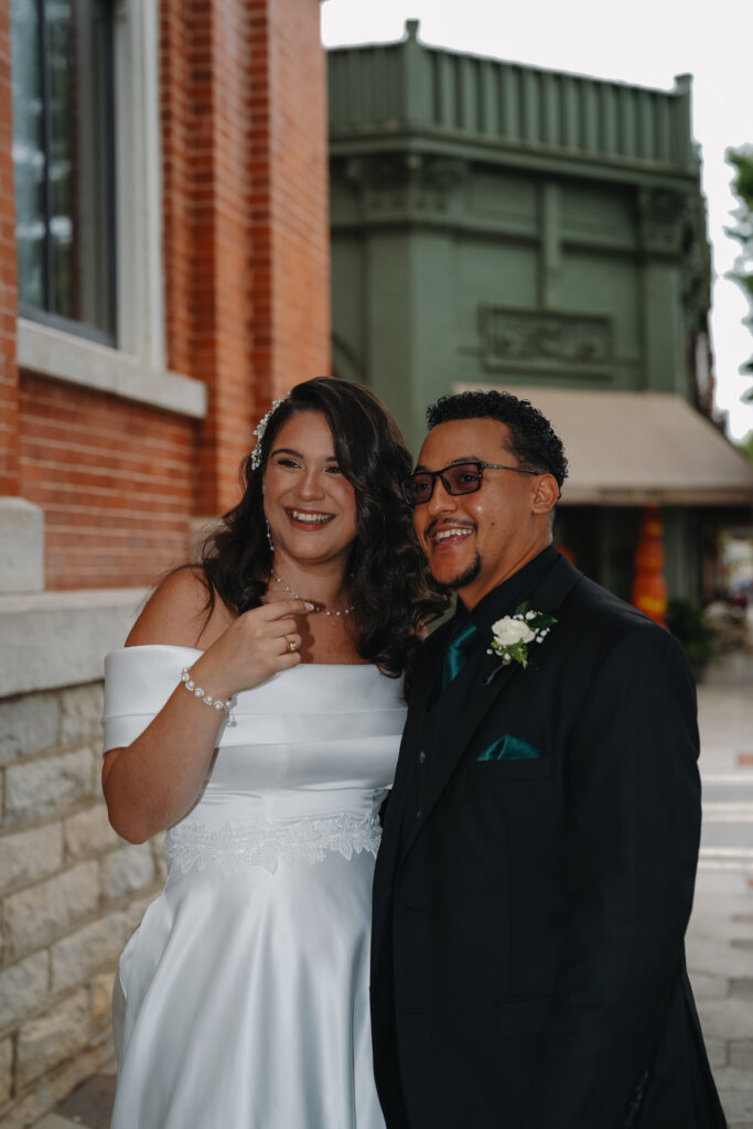Couple laughing in Mystic Falls square in Covington, Georgia