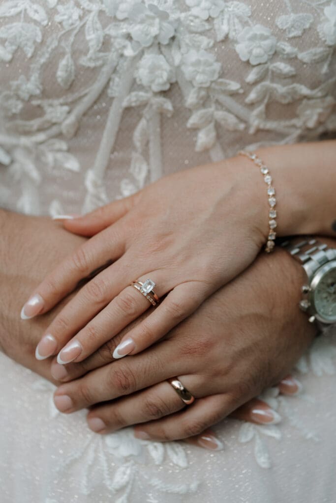 Bride and Groom hands together and posed at Vecoma at the yellow river, in Snellville Georgia.