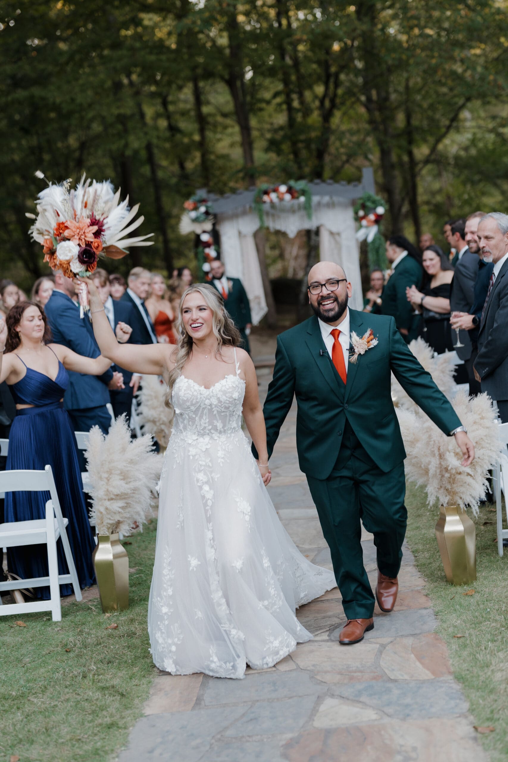 Bride and Groom walking down the aisle at Vecoma at the yellow river, in Snellville Georgia.
