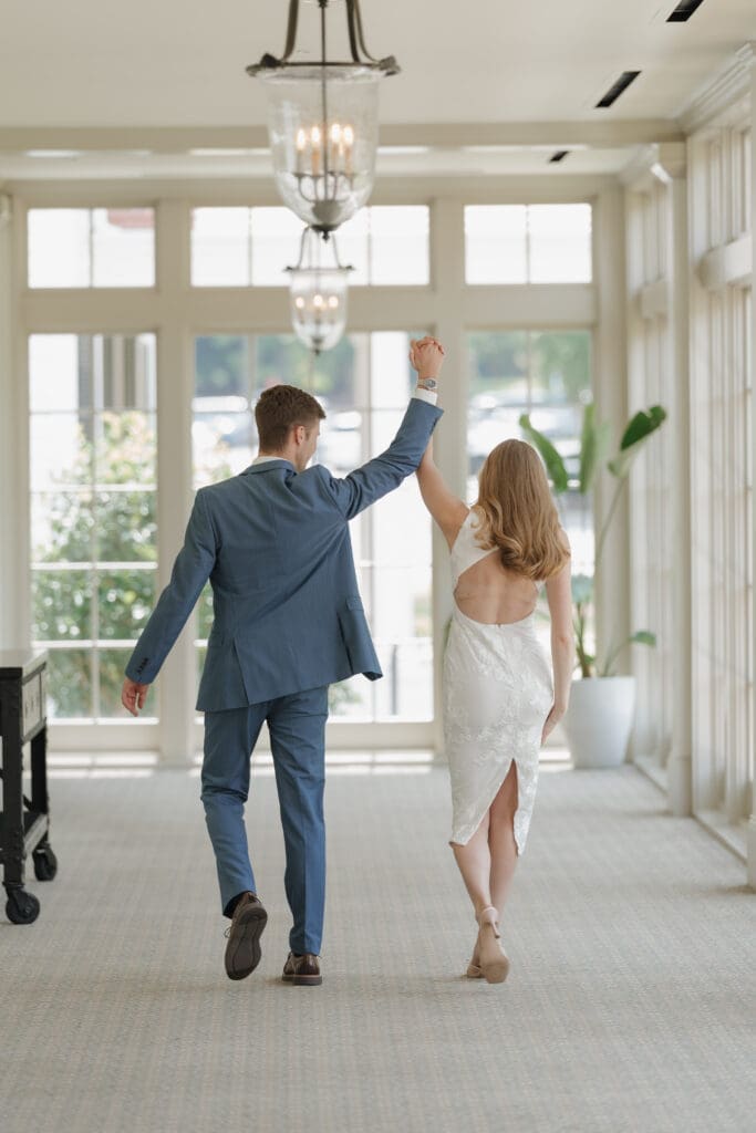 engaged couple practicing their exit for their wedding